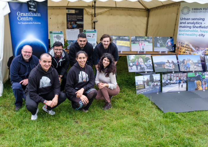 The team of the Grantham Centre for Sustainable Futures poses in front of their stall. Photo by Jeremy Abrahams